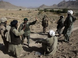Afghan Civilian talking with a soldier from the Afghan Security Force