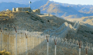A photo of the highly fortified border fence along the Durand Line, often with mountainous terrain visible, symbolizing the difficulty of border control and the movement of militants.